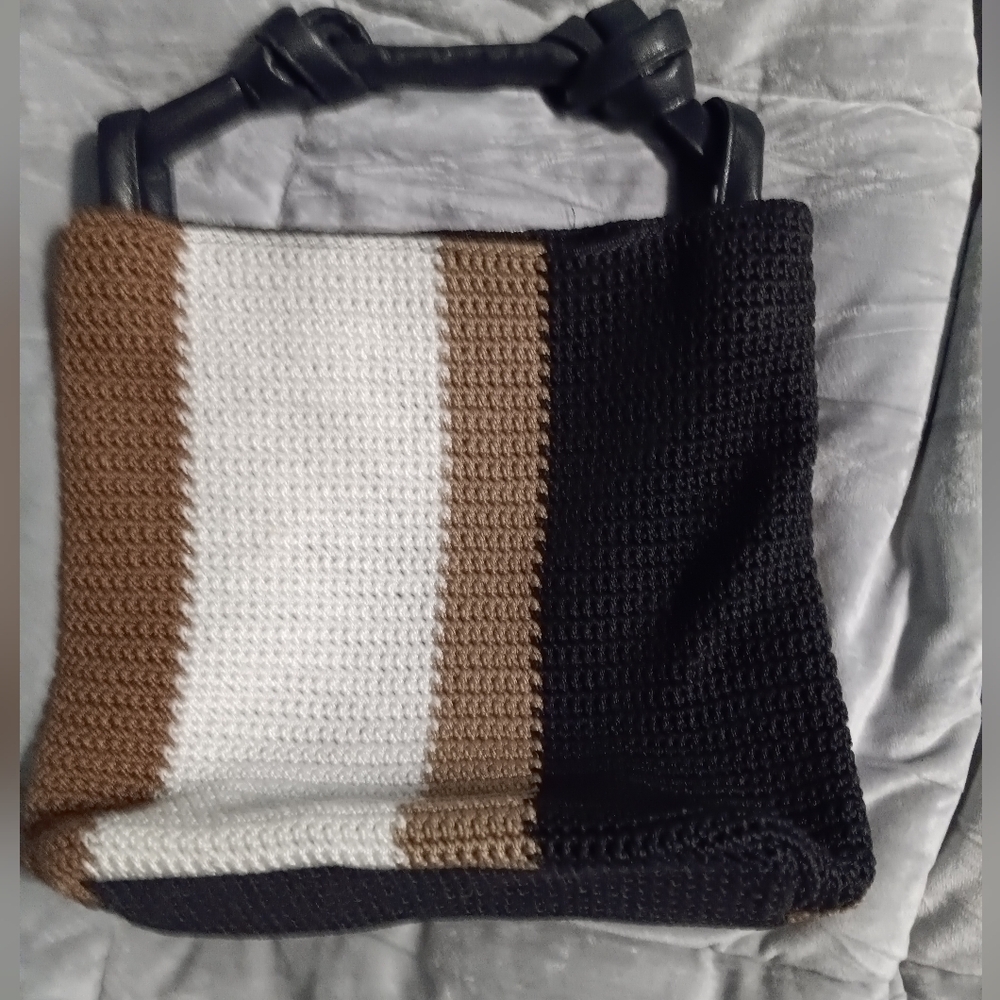 NWOT, NEVER USED THE SAK HANDBAG.